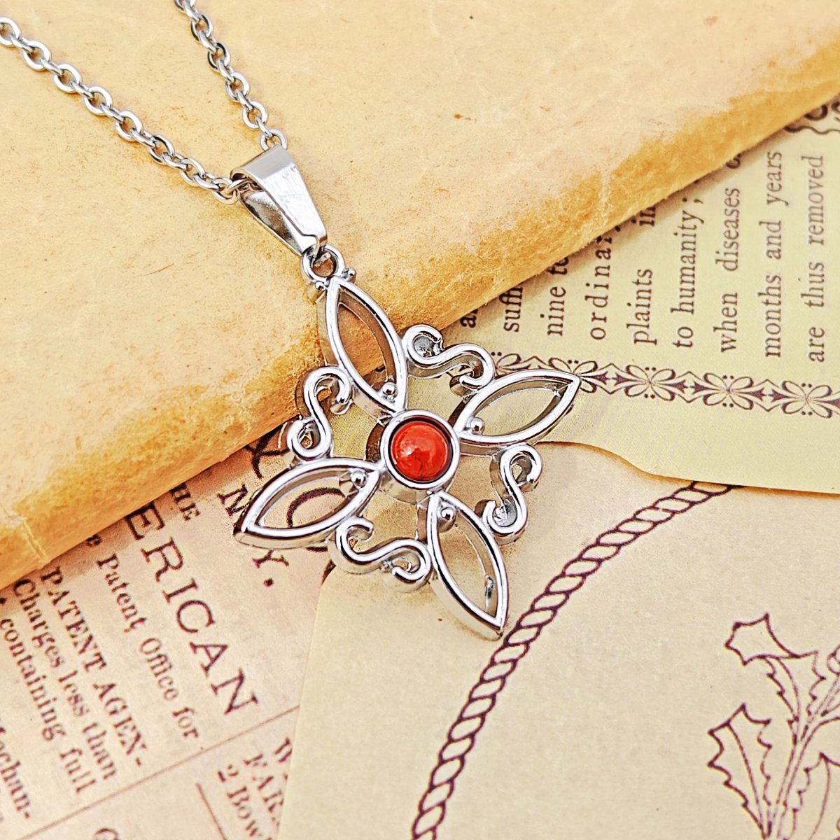 Collar Nudo de Bruja Acero Inox. con Jaspe Rojo - Mystical Tienda